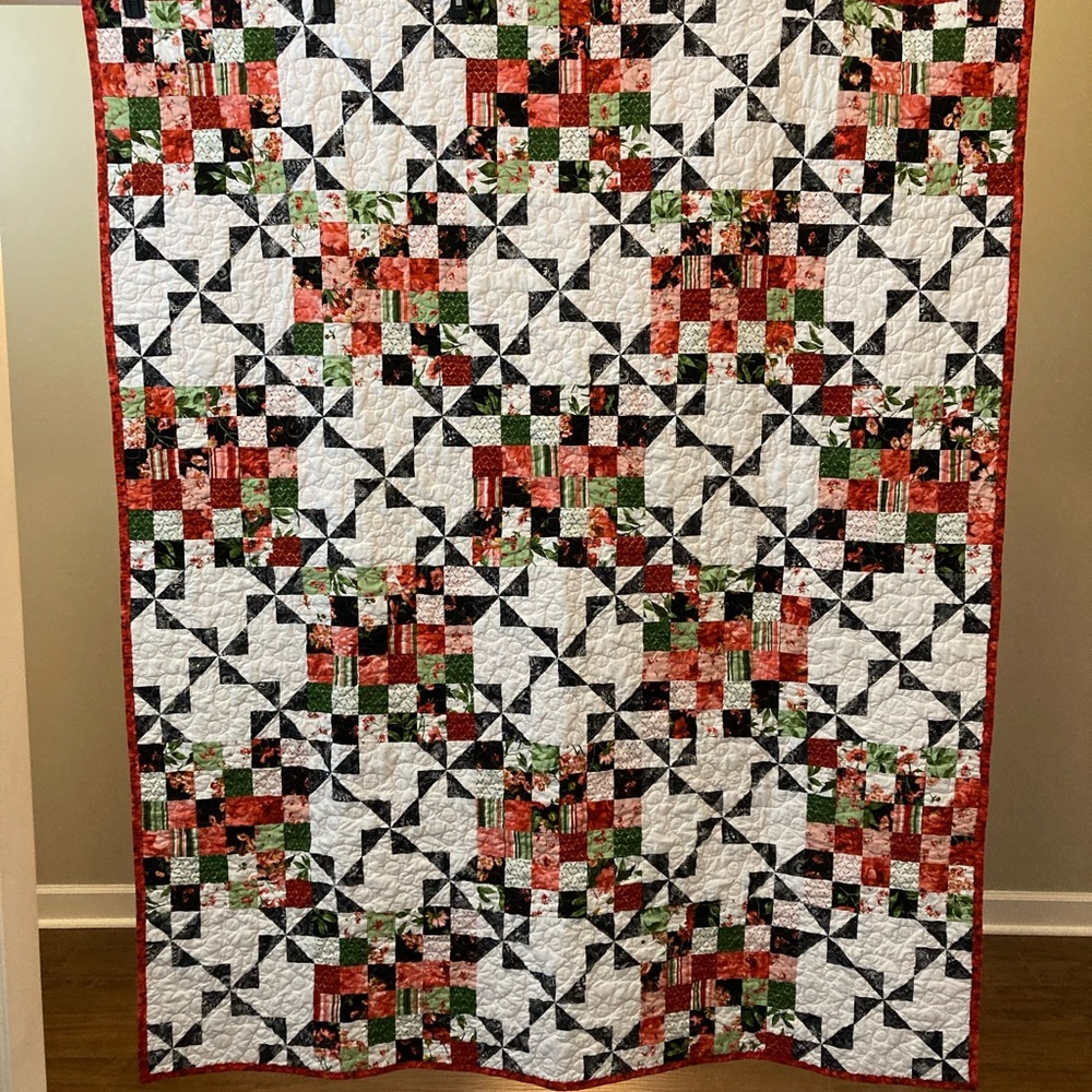 Lovely handmade throw size quilt. Perfect for snuggling on the couch